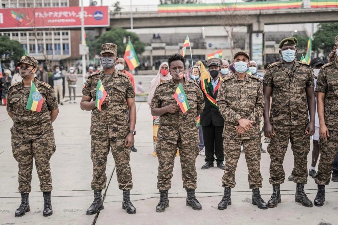 Members from Ethiopia's national defense force stand in Addis Ababa during a ceremony held to support the Ethiopian military that is battling against the Tigray People's Liberation Front (TPLF) in the Amhara and Afar regions. (AFP)