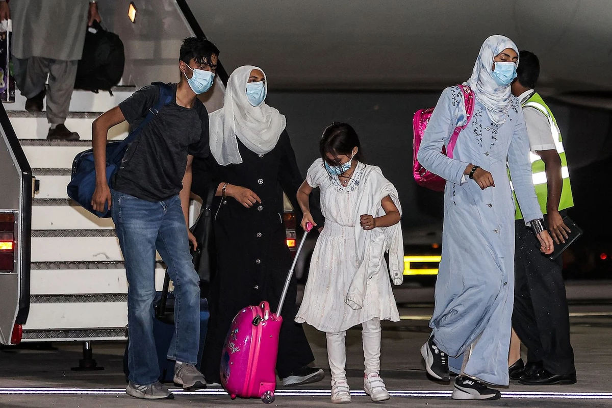Evacuees from Afghanistan arrive at Hamad International Airport in Qatar's capital Doha on the first flight carrying foreigners out of the Afghan capital since the conclusion of the US withdrawal last month, September 9, 2021. (AFP)