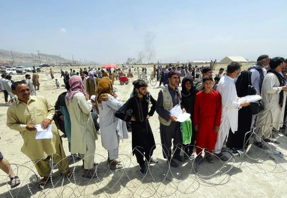 In this Tuesday, Aug. 17, 2021 file photo hundreds of people gather outside the international airport in Kabul, Afghanistan. (AP)