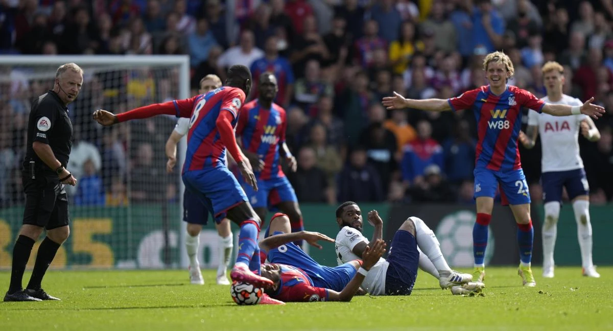 Crystal Palace’s Jordan Ayew reacts injured at the ground during the English Premier League match against Tottenham Hotspur at the Selhurst Park stadium in London on Saturday. (AP)