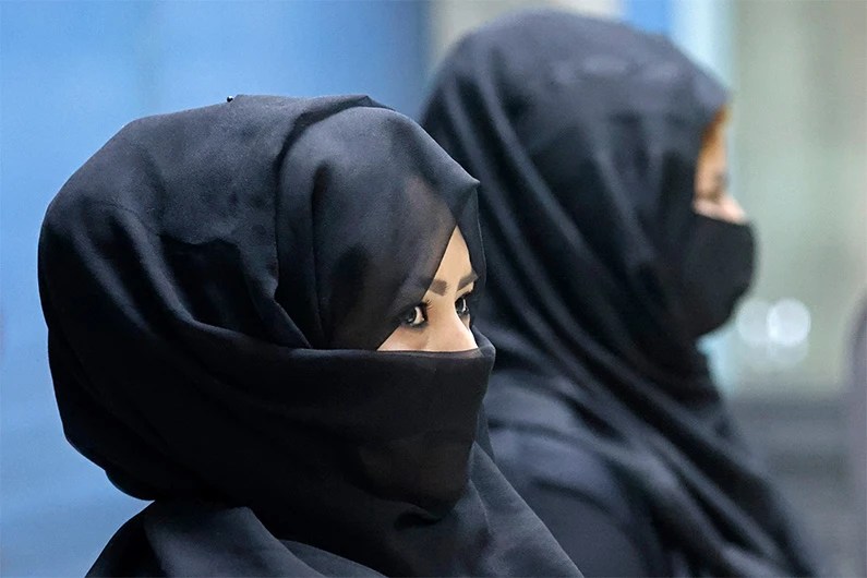 Afghan women airport workers are pictured at a security checkpoint of the airport in Kabul on September 12, 2021. (AFP)