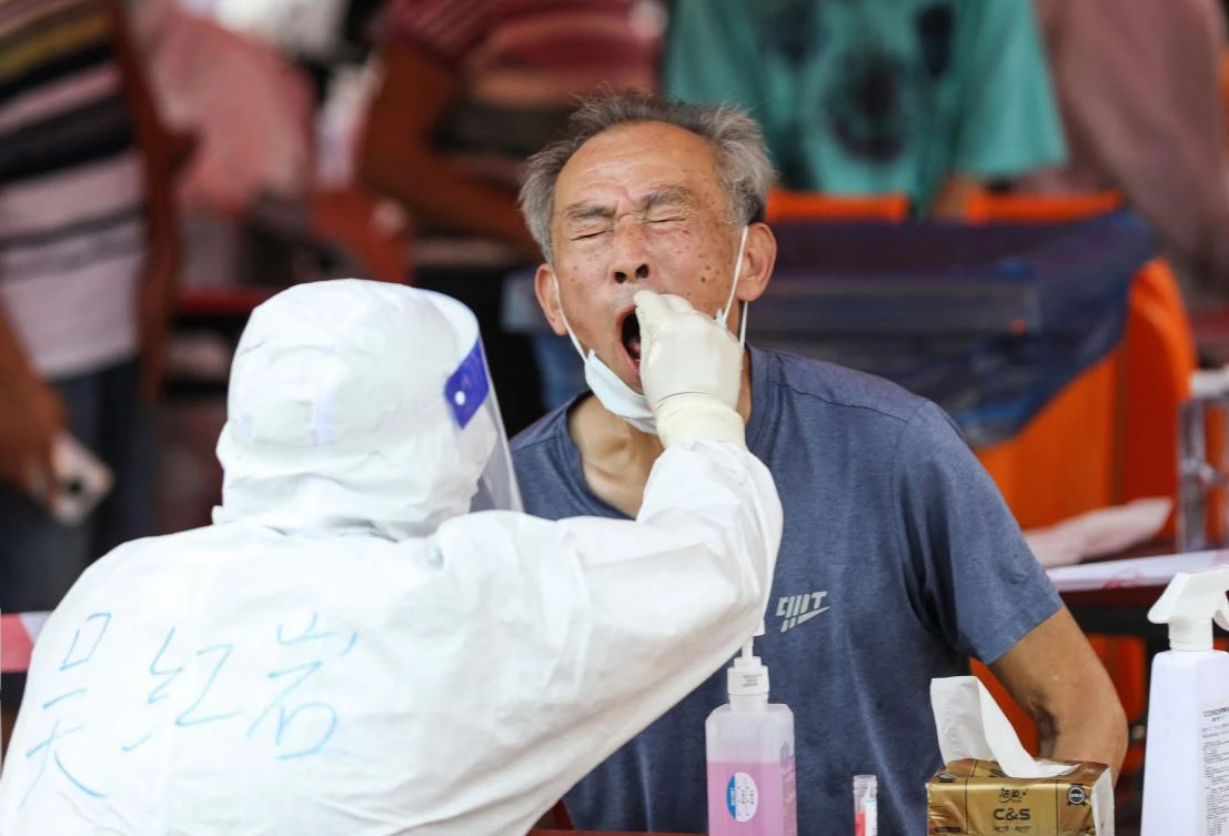 A Delta variant outbreak in July and August spread to several provinces, raising concern about new and more contagious variants. (AFP)