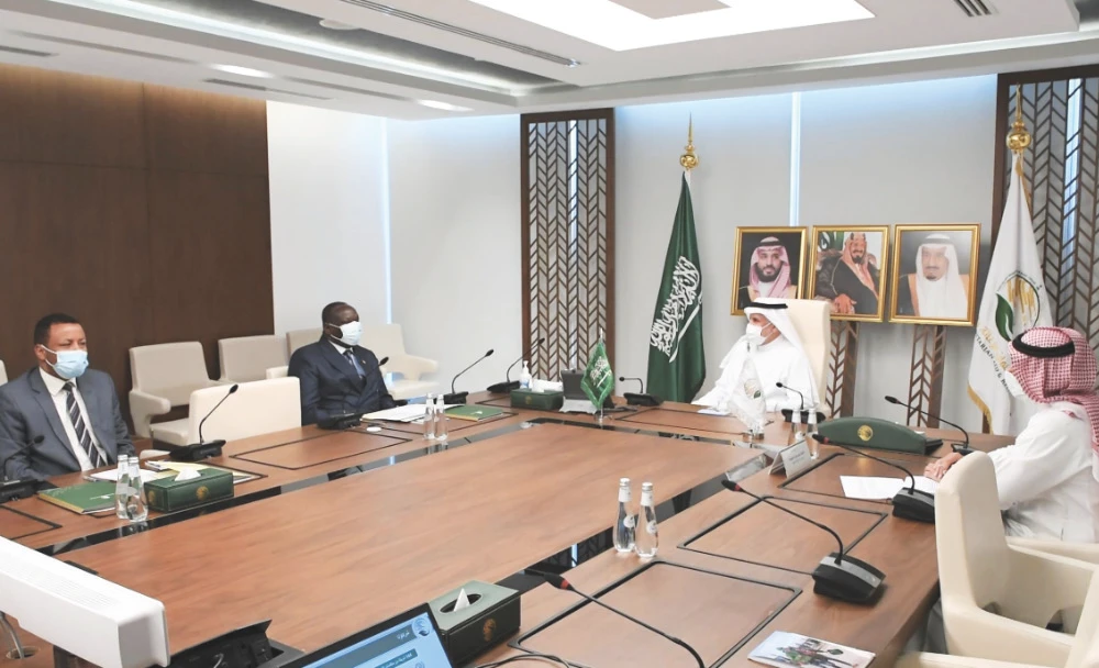 Dr. Abdullah Al-Rabeeah, supervisor-general of King Salman Humanitarian Aid and Relief Center, with Peter Nicholas Ojigo, Kenyan envoy to KSA. (SPA)