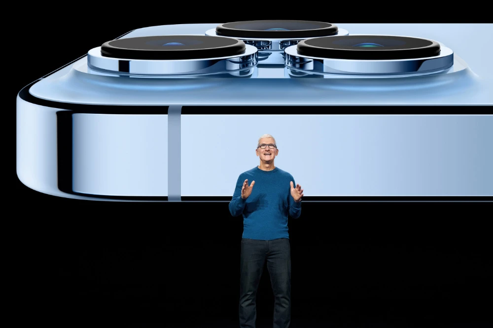 Apple CEO Tim Cook showcases the advanced camera system on the new iPhone 13 Pro. (Apple/Reuters)