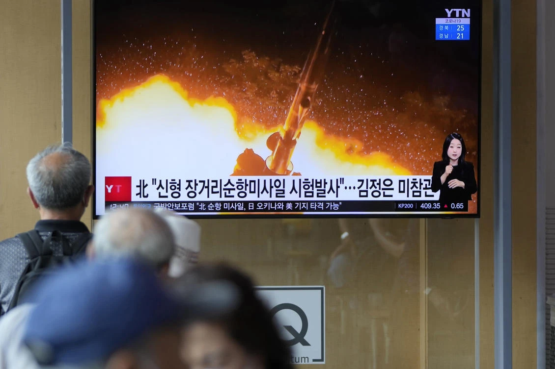 Seoul residents watch a news program showing North Korea’s test-firing of newly developed long-range cruise missiles over the weekend. (AP)