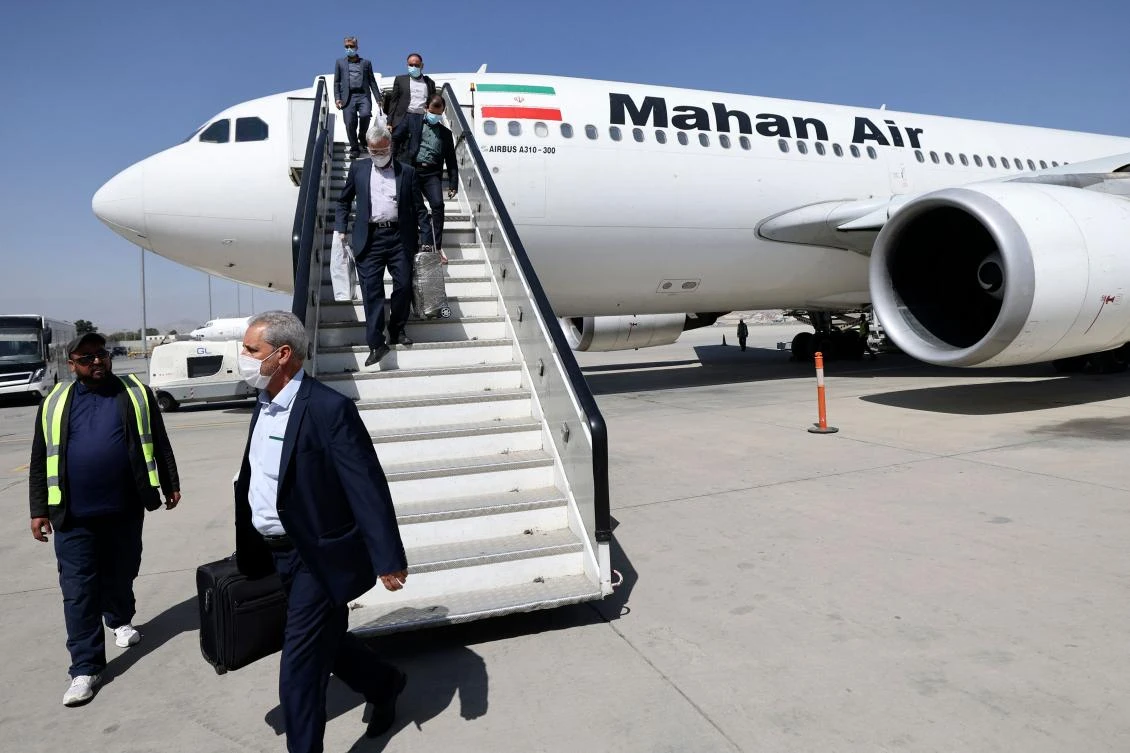 Passengers get off a Mahan Air aircraft at Kabul airport on Sept. 15, 2021. (AFP)