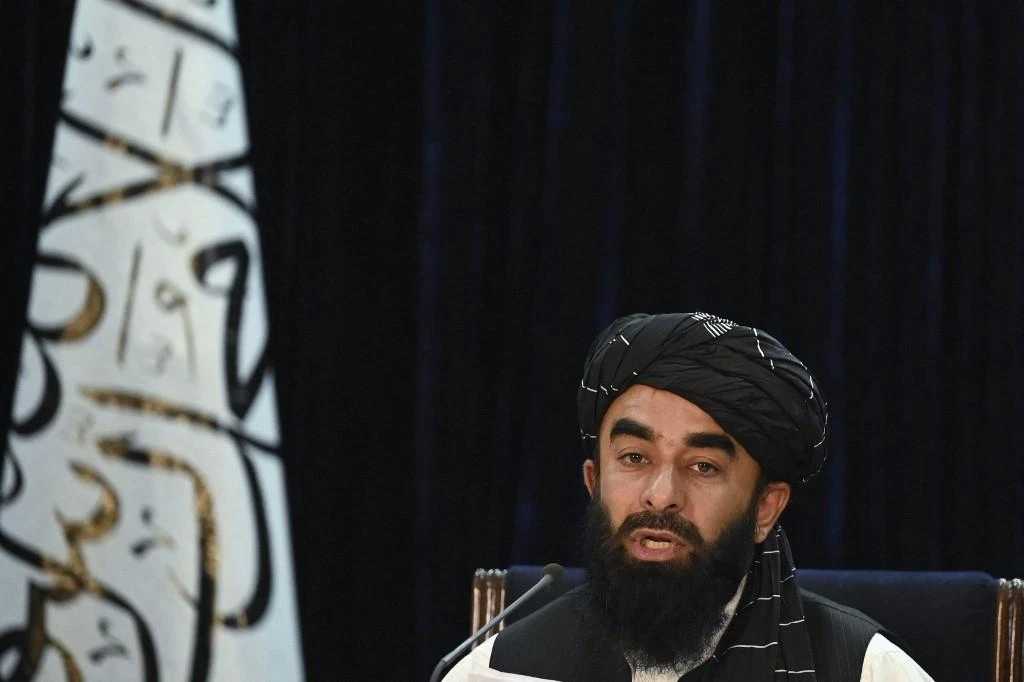 Above, Taliban spokesman Zabihullah Mujahid speaks during a press conference in Kabul on Sept. 7, 2021 announcing leaders of their new government. (AFP)
