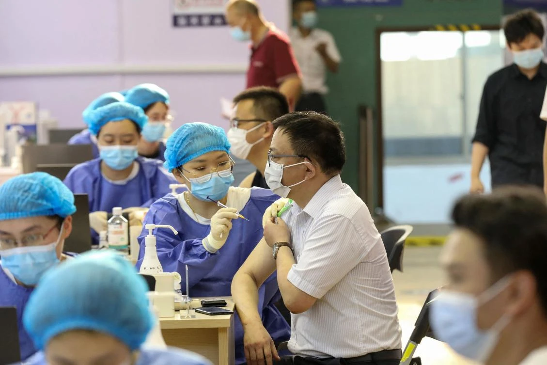 Top virologist Zhong Nanshan said last month that China is likely to have 80 percent of its population inoculated by the end of the year, reaching herd immunity. (AFP)