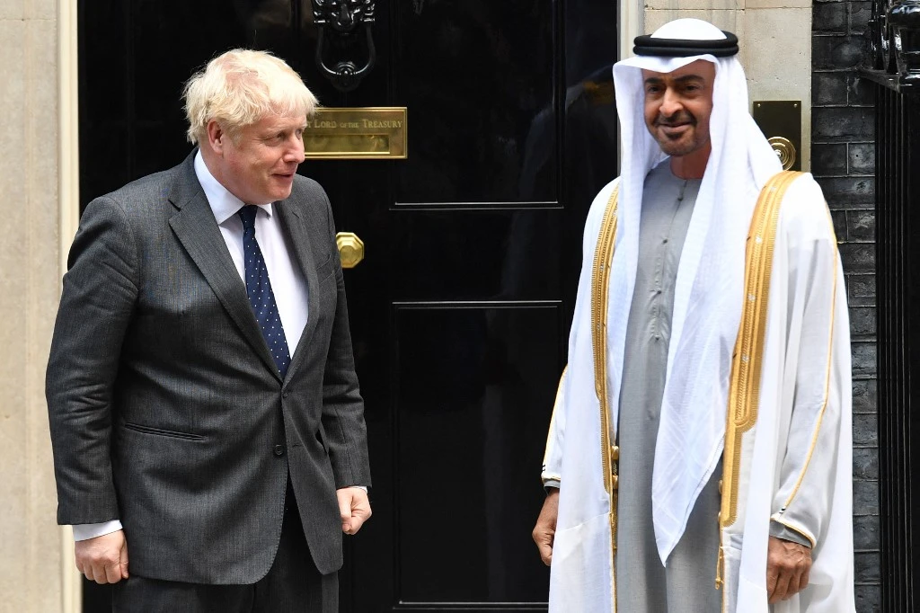 Britain's Prime Minister Boris Johnson (L) greets Crown Prince of Abu Dhabi, Mohamed bin Zayed Al Nahyan on his arrival at No. 10, Downing Street in central London, on September 16, 2021. (AFP)