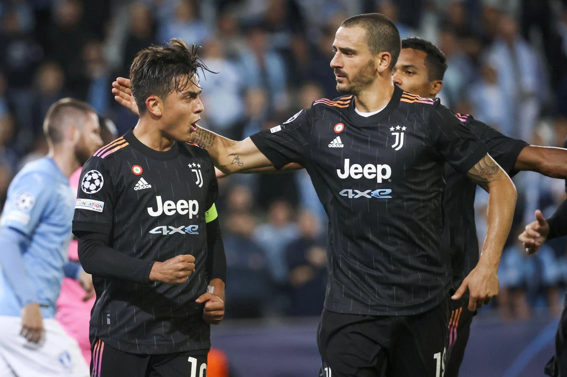 Juventus’ Paulo Dybala celebrates scoring a penalty with teammate Leonardo Bonucci during the Champions League group H match against Malmo FF on Tuesday. (AP)