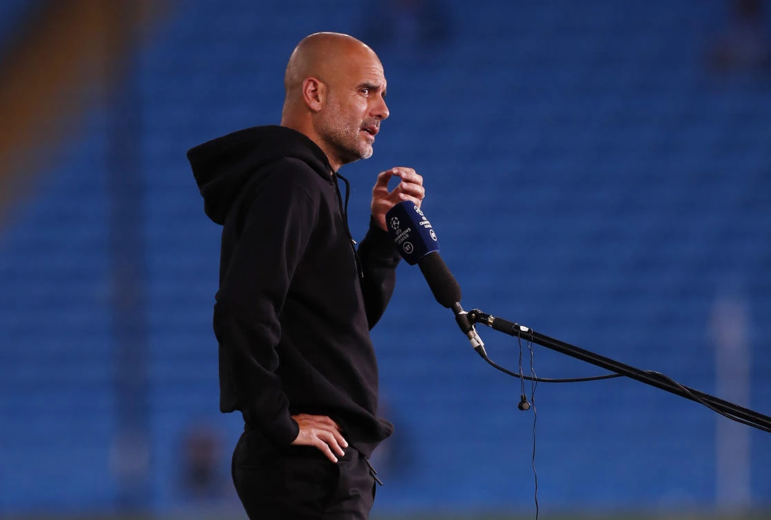 Manchester City manager Pep Guardiola interviewed before their Champions League Group A against RB Leipzig at Etihad Stadium in Manchester. (Reuters)
