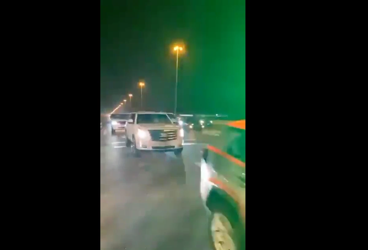 Footage shared by Abu Dhabi TV's Twitter account shows cars driving behind police vehicles to cross the Dubai-Abu Dhabi border.