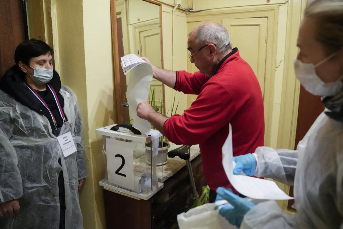 Russian social media was inundated with reports of ballot stuffing and military servicemen patrolling polling stations. (AP)