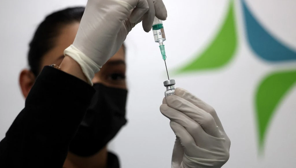 The UAE has administered total 19,412,656 COVID-19 doses so far, for a vaccine distribution rate equivalent to 196.28 doses per 100 people. (AFP)