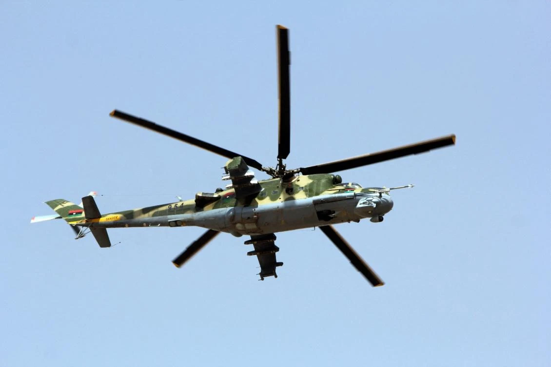 A Libyan military attack helicopter flies over the eastern city of Benghazi during a parade to celebrate the second anniversary of NATO's first military operation in Libya on March 19, 2013. (File/AFP)