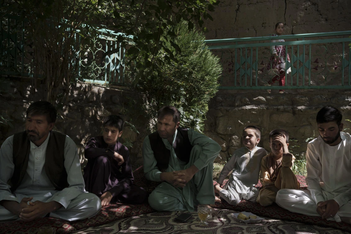 Painda Mohammed sits with family members at their house’s yard near Kabul on Friday. Painda’s son, Fida Mohammad died after falling from a departing US Air Force C-17 taking off from Kabul’s International Airport. (AP)