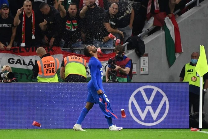 Hungary’s fans throw beer cups at England’s forward Raheem Sterling during World Cup 2022 qualification match against England in Budapest. FIFA said Hungary will play its next qualifier without spectators. (AFP)