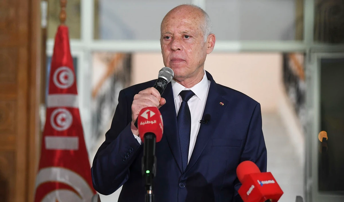 Tunisian President Kais Saied waves to Tunisian citizens as he delivers a speech during his visit to Sidi Bouzid, Tunisia, Monday, Sept. 20, 2021. (AP)