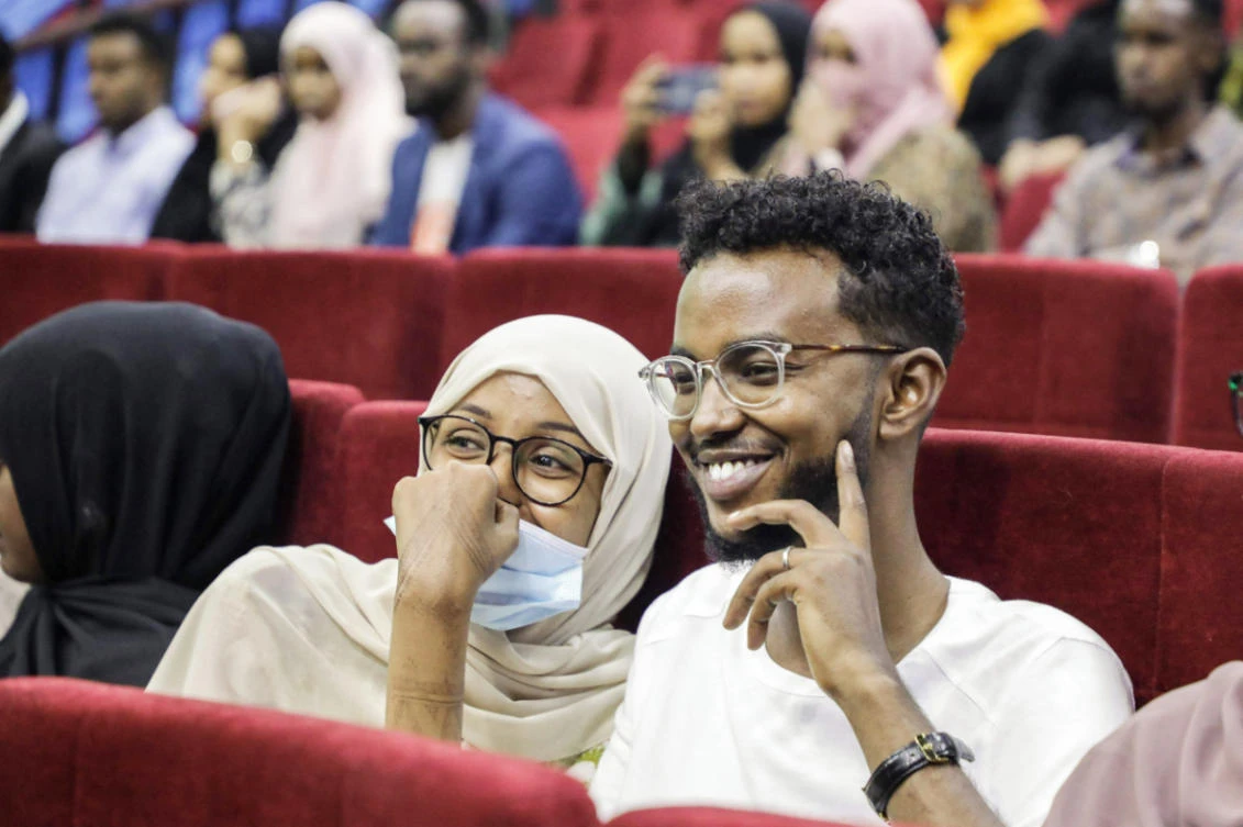 Viewers wait for the first screening of Somali films at The Somali National Theatre in Mogadishu, on September 22, 2021, which has been opened for the first time to public after its inauguration in 2020. (AFP)