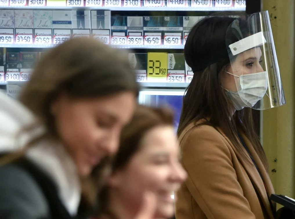 A girl wearing a protective faceshield walks in the center of Kiev on May 27, 2020 as Ukarine eases lockdown measures taken to curb the spread of the COVID-19 (the novel coronavirus). (File/AFP)