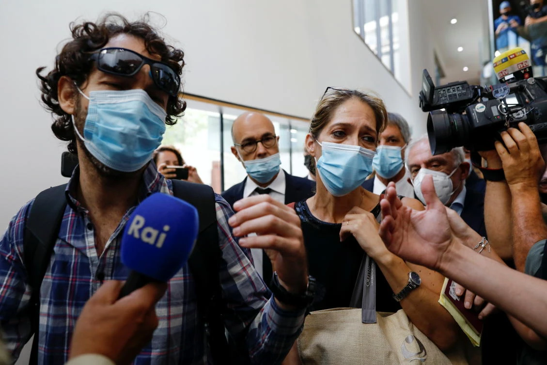 Aya Biran, the paternal aunt of Eitan Biran, speaks to members of the media before the start of a court hearing over the alleged kidnapping of Biran at a court in Tel Aviv on Sept. 23, 2021. (Reuters)