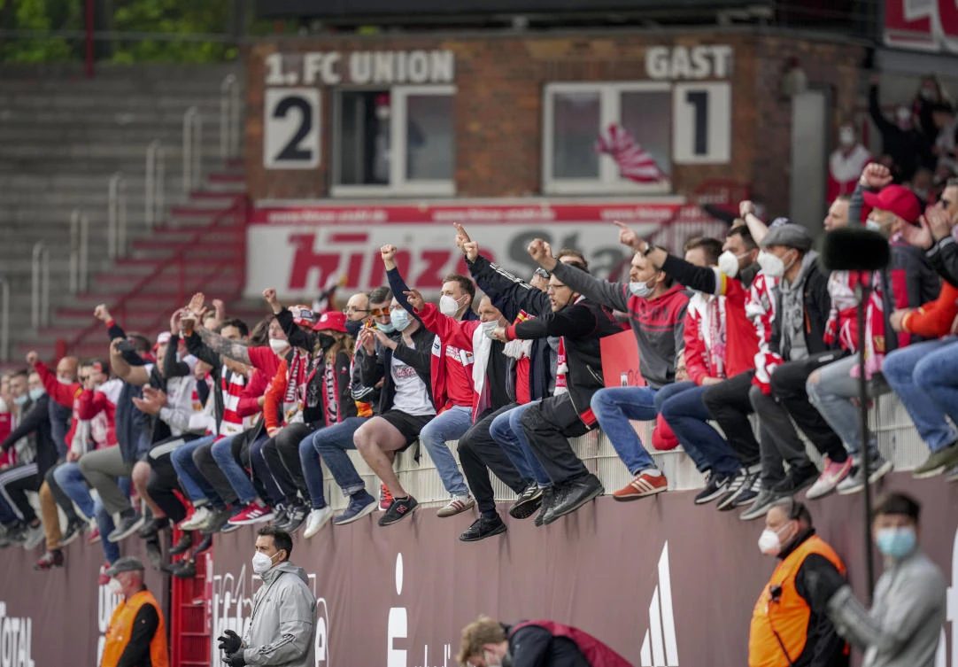 A file photo of Union fans cheer for their team after the German Bundesliga match between FC Union Berlin and RB Leipzig in Berlin. German clubs are pushing to ease stadium restrictions. (AP)