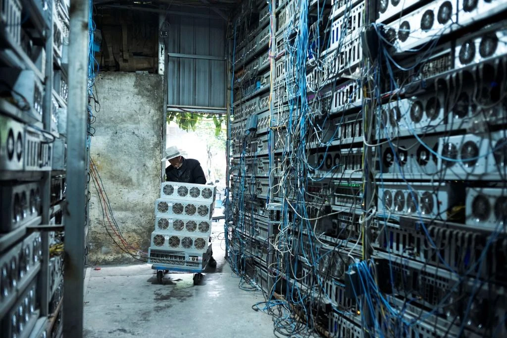 A local resident works at a cryptocurrency farm in Dujiangyan in China's southwestern Sichuan province. (File/AFP)