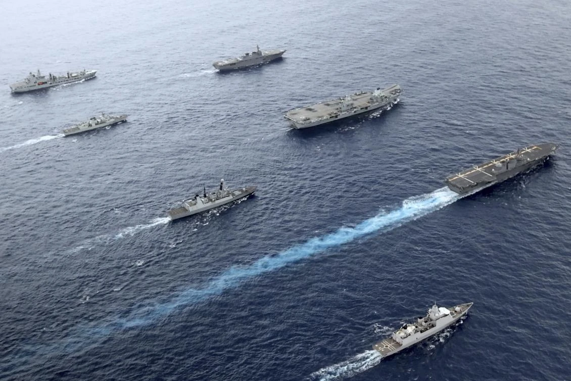 Front to back; HNLMS Evertsen, JS Izumo, HMS Defender, HMS Queen Elizabeth, HMCS Winnipeg, JS Ise, RFA Tidespring. (AP)
