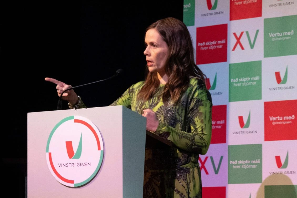 Icelandic Prime Minister Katrin Jakobsdottir talks to supporters of her Left Green Movement at a party event in Reykjavik on September 25, 2021 after the announcement of partial results in the country's general elections. (AFP)