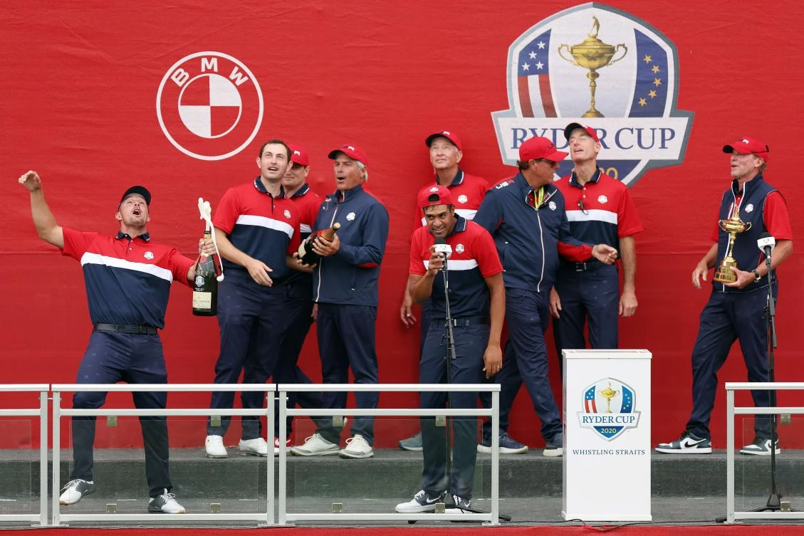 Members of team United States celebrate with champagne after defeating team Europe during Sunday Singles Matches of the 43rd Ryder Cup on Sept. 26, 2021 in Kohler, Wisconsin. (Getty Images/AFP)