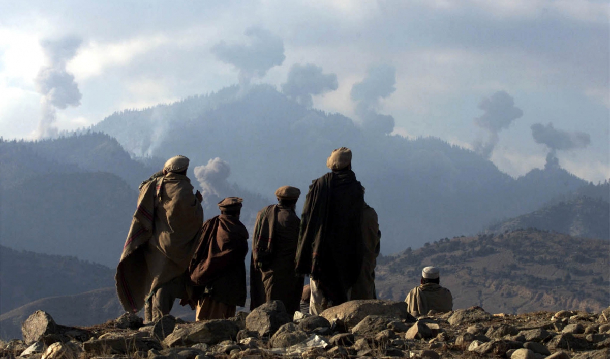 Anti-Taliban fighters watch U.S. bombs fall in the Tora Bora mountains in Afghanistan, Dec. 16, 2001. (Reuters)
