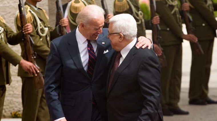 Joe Biden, at the time US VP, reviews a guard of honor in Ramallah alongside Palestinian Authority President Mahmoud Abbas, Mar. 2010. (Getty Images)