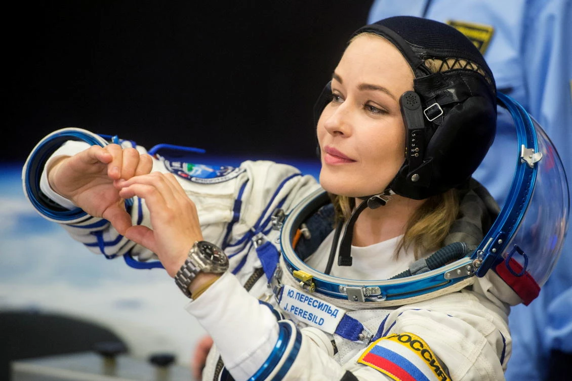 The International Space Station (ISS) crew member Russian actor Yulia Peresild gestures after donning space suit shortly before the launch at the Baikonur Cosmodrome, Kazakhstan October 5, 2021. Andrey Shelepin/GCTC/Roscosmos/Handout via REUTERS ATTENTION EDITORS - THIS IMAGE HAS BEEN SUPPLIED BY A THIRD PARTY. MANDATORY CREDIT.
