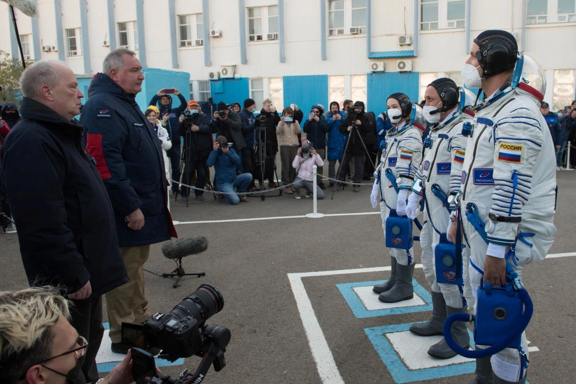 The International Space Station (ISS) crew members Russian cosmonaut Anton Shkaplerov, film director Klim Shipenko and actor Yulia Peresild report before departure for boarding the Soyuz MS-19 spacecraft for the launch at the Baikonur Cosmodrome, Kazakhstan October 5, 2021. Andrey Shelepin/GCTC/Roscosmos/Handout via REUTERS ATTENTION EDITORS - THIS IMAGE HAS BEEN SUPPLIED BY A THIRD PARTY. MANDATORY CREDIT.