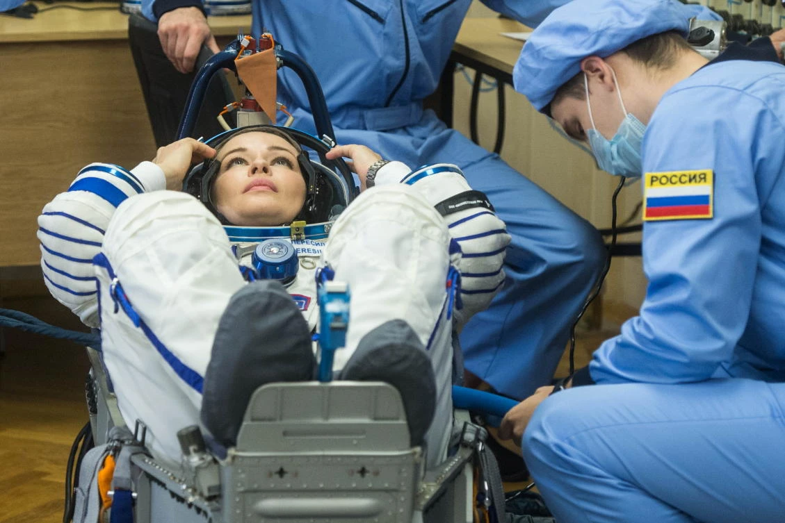 The International Space Station (ISS) crew member Russian actor Yulia Peresild looks on during space suit check shortly before the launch at the Baikonur Cosmodrome, Kazakhstan October 5, 2021. Andrey Shelepin/GCTC/Roscosmos/Handout via REUTERS ATTENTION EDITORS - THIS IMAGE HAS BEEN SUPPLIED BY A THIRD PARTY. MANDATORY CREDIT.