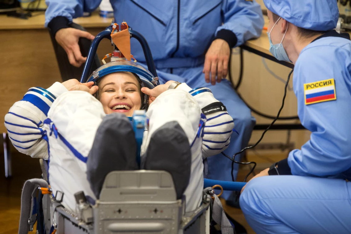 The International Space Station (ISS) crew member Russian actor Yulia Peresild reacts during space suit check shortly before the launch at the Baikonur Cosmodrome, Kazakhstan October 5, 2021. Andrey Shelepin/GCTC/Roscosmos/Handout via REUTERS ATTENTION EDITORS - THIS IMAGE HAS BEEN SUPPLIED BY A THIRD PARTY. MANDATORY CREDIT.