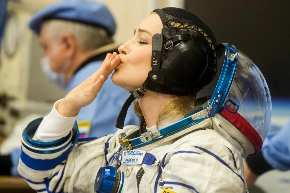 The International Space Station (ISS) crew member Russian actor Yulia Peresild blows a kiss after donning space suit shortly before the launch at the Baikonur Cosmodrome, Kazakhstan October 5, 2021. Andrey Shelepin/GCTC/Roscosmos/Handout via REUTERS ATTENTION EDITORS - THIS IMAGE HAS BEEN SUPPLIED BY A THIRD PARTY. MANDATORY CREDIT.