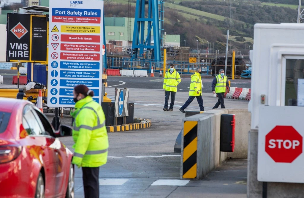 An official checks a motorist as truckers carrying freight from Scotland disembark a ferry at the Port of Larne in County Antrim, Northern Ireland. (File/AFP)