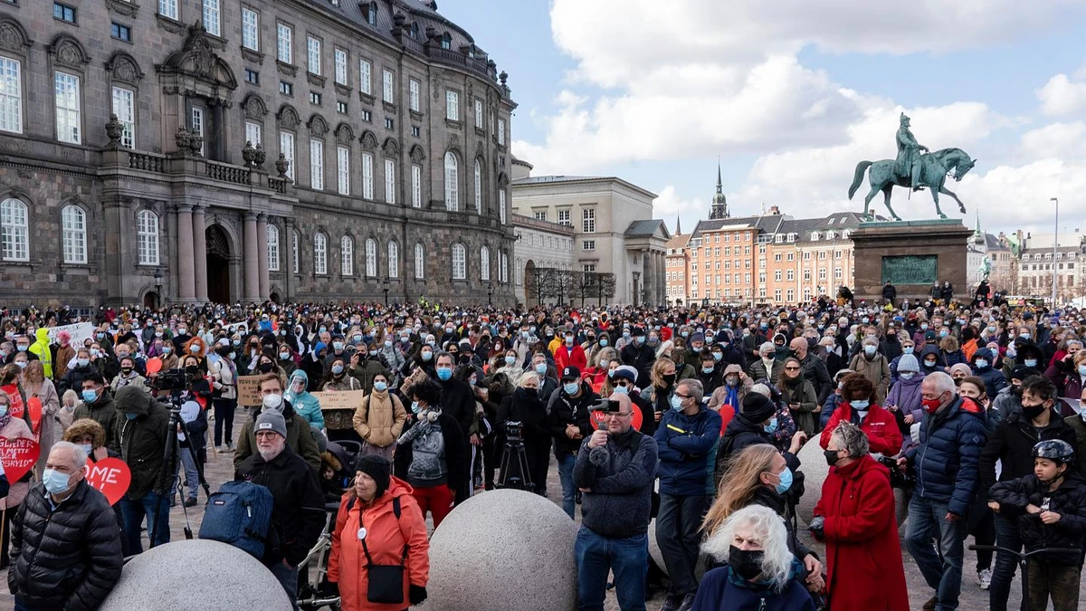 People attend a demonstration against the tightening of Denmark’s migration policy in Copenhagen, April 21, 2021. (AP Photo)