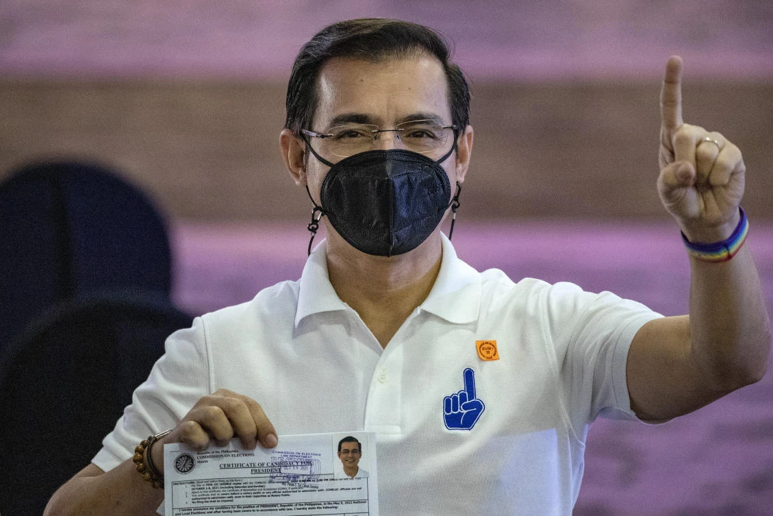 Manila City Mayor Isko Moreno gestures after filing his certificate of candidacy for next year's presidential elections before the Commission on Elections at the Sofitel Harbor Garden Tent in Metropolitan Manila, Philippines on Monday Oct. 4, 2021. (AP)