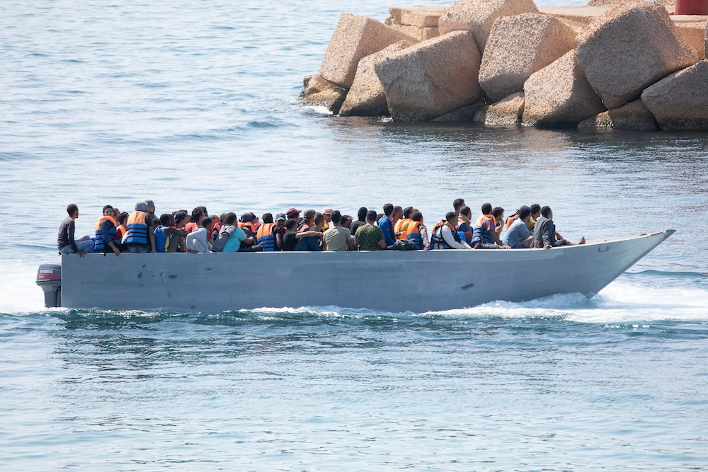 Migrants arrive at the Lampedusa island, Italy, on Sunday. (AP)