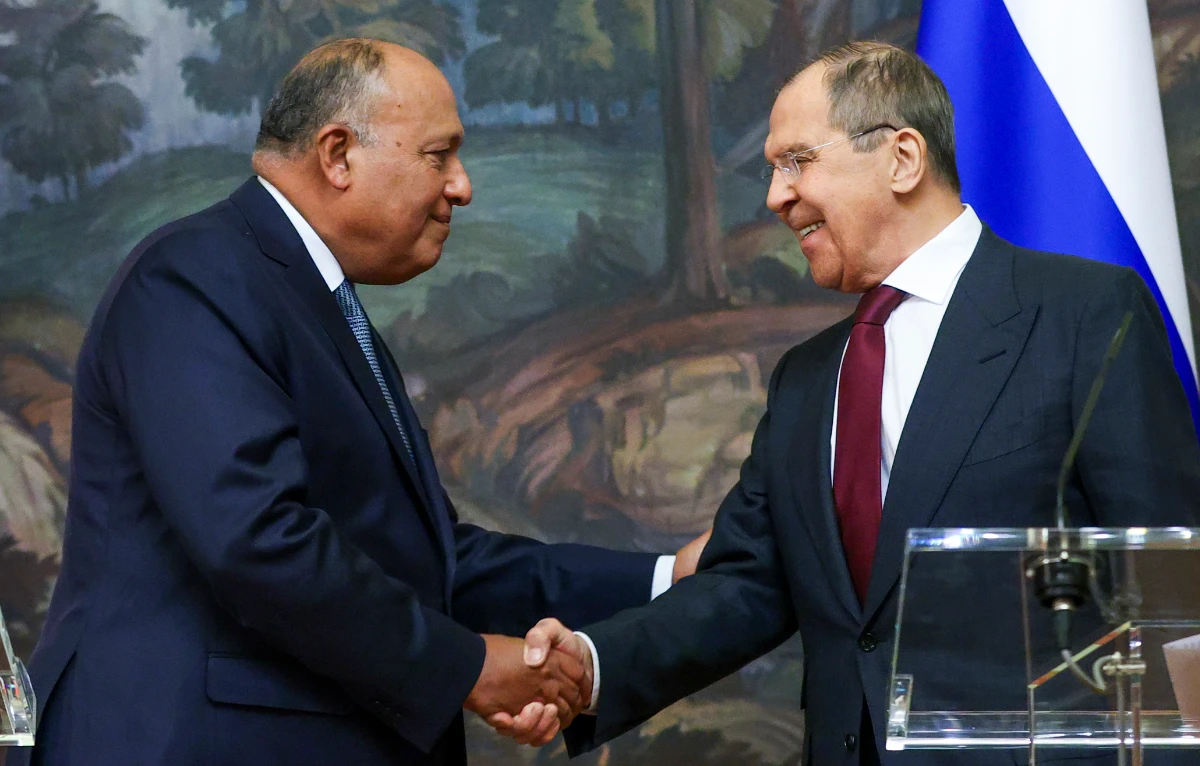 Russian Foreign Minister Sergey Lavrov, right, and Egyptian Foreign Minister Sameh Shoukry shake hands as they leave a joint news conference following talks in Moscow, Russia, Monday, Oct. 4, 2021. (Russian Foreign Ministry Press Service/AP)