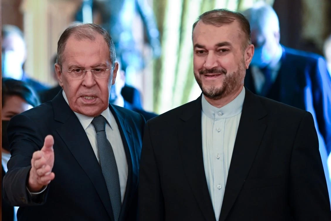 Russian Foreign Minister Sergey Lavrov, left, and Iranian Foreign Minister Hossein Amirabdollahian enter a hall for their talks in Moscow, Russia, Wednesday, Oct. 6, 2021. (AP