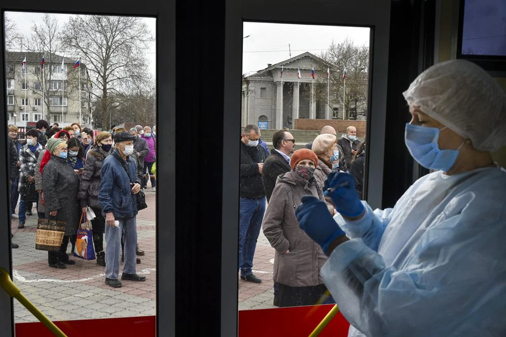 Russian medical worker prepares a shot of Russia's Sputnik V coronavirus vaccine in Simferopol, Crimea, Tuesday, April 13, 2021. (AP)