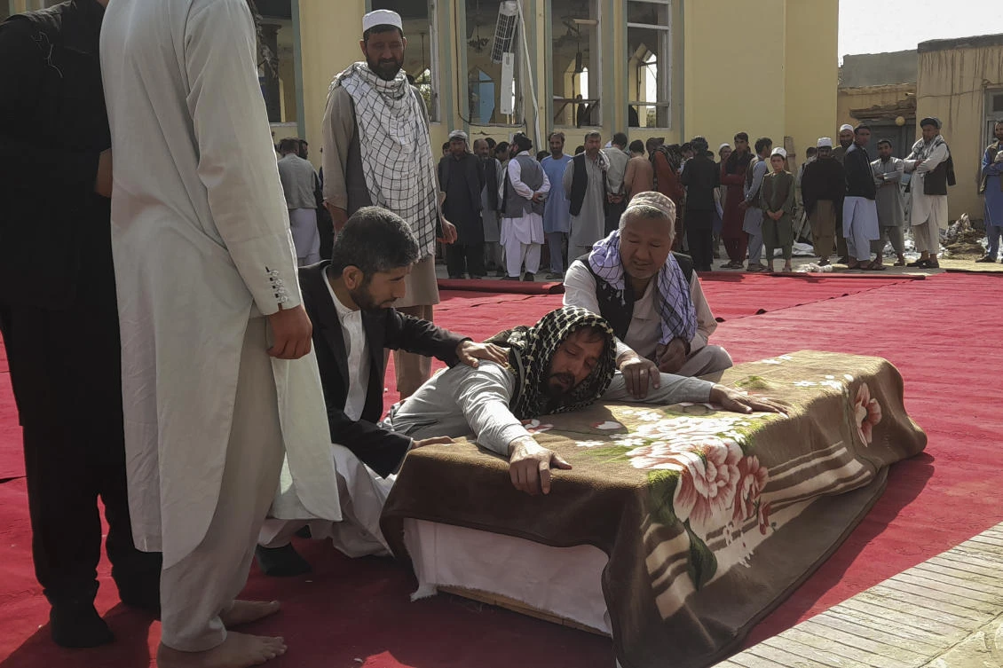 Relatives and residents attend a funeral ceremony for victims of a suicide attack at the Gozar-e-Sayed Abad Mosque in Kunduz, northern Afghanistan on Saturday. (AP)