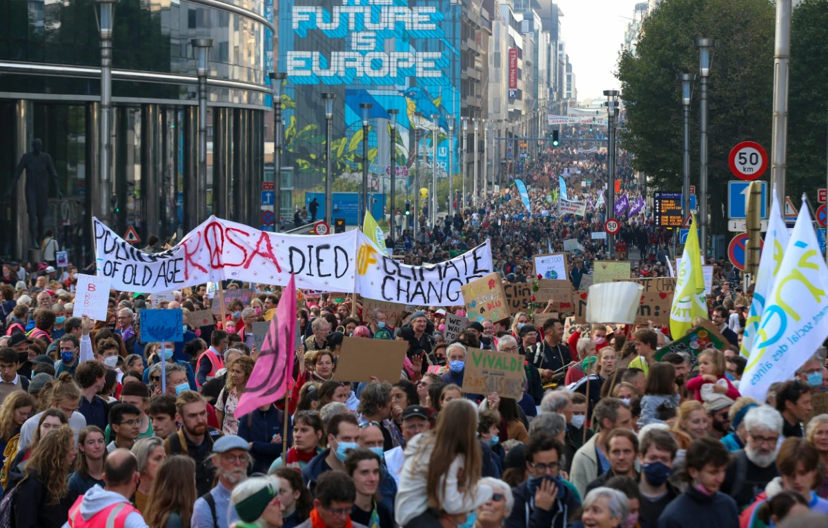 Protesters take part in a demonstration against climate change in Brussels, on October 10, 2021, ahead of the COP26 climate summit. (AFP)