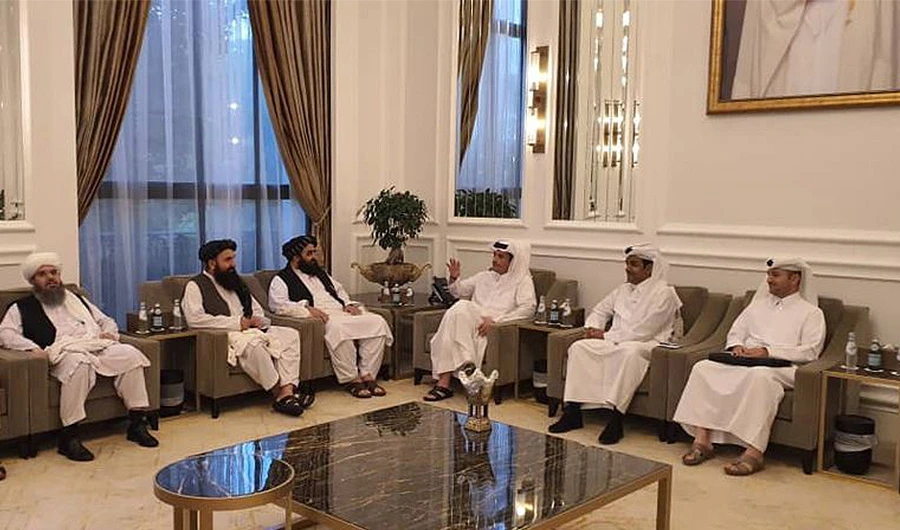 Taliban delegates meet with Qatar delegates in Doha, Qatar, in this handout photo uploaded to social media on October 9, 2021. (REUTERS)