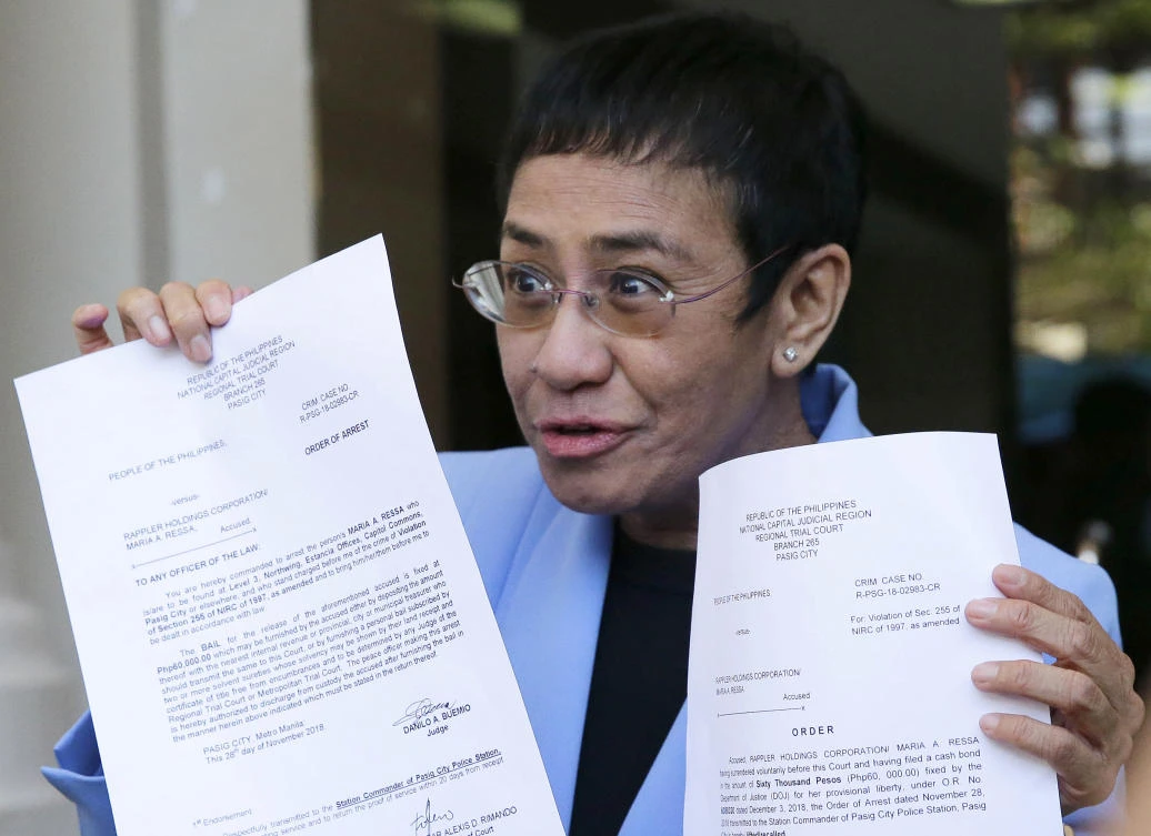 Maria Ressa, above, co-founder of news website Rappler, and Russian journalist Dmitry Muratov were awarded the Nobel Peace Prize on Friday. (AP)
