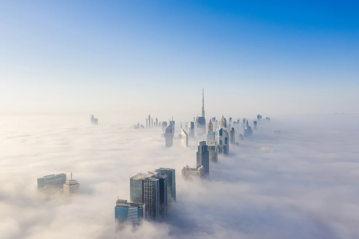 Aerial view of Dubai frame and skyline covered in dense fog during winter season (Getty)