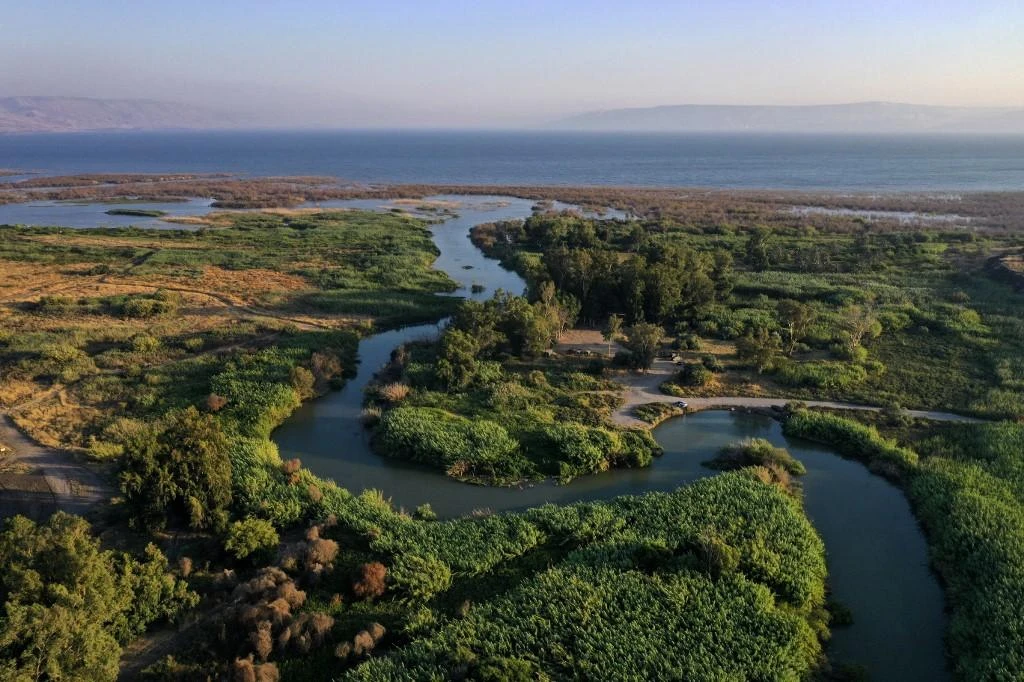 Above, the Jordan river flowing through the Beteha (Bethsaida Valley) into the northern part of the Sea of Galilee, or Lake Tiberias, one of the main water sources in Israel. (AFP)